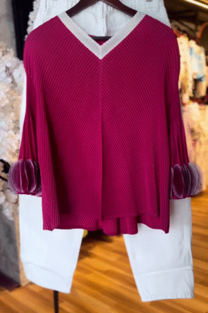 Women’s Textured Red Long-Sleeve Top with V-Neck Collar & Pleated Sleeve Detail – Paired with White Slim Pants
