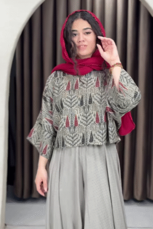 Women’s Red Printed Headscarf with Abstract Top & Gray Wide-Leg Pants – Boho Urban Doorway Portrait Ensemble