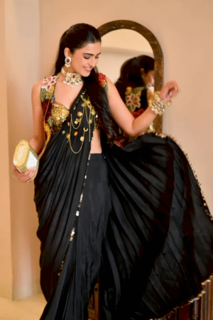 Women’s Black Saree with Gold Embellishments & Pleated Draping – Elegant Ethnicwear Styled with Traditional Bracelet